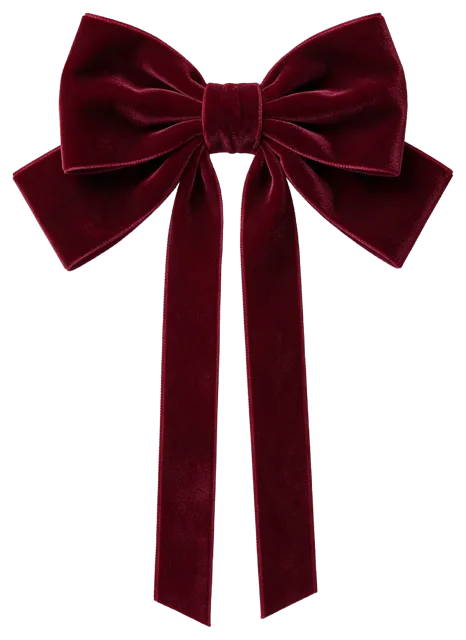 A large symmetrical hand-tied deep burgundy velvet bow with long hanging tails