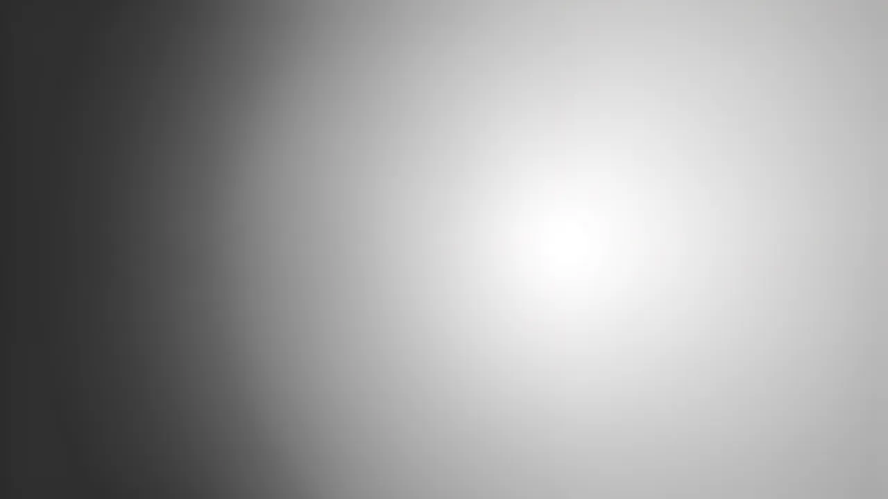 Smooth soft gradient transitioning from deep charcoal gray on the left to bright pale silver on the right