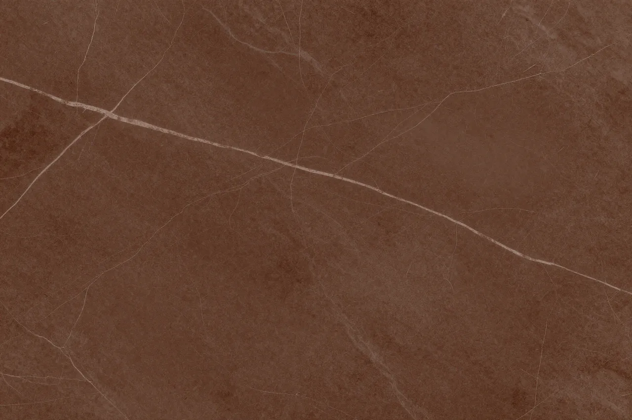 Full frame close-up of chocolate brown marble with fine pale light veining across its smooth surface