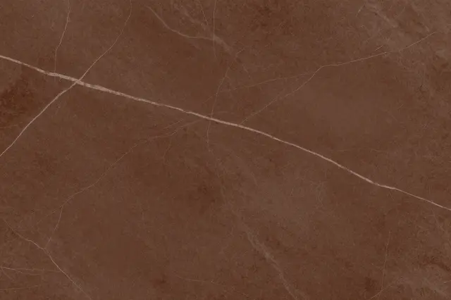 Full frame close-up of chocolate brown marble with fine pale light veining across its smooth surface