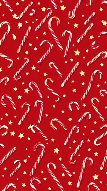 Scattered red and white striped candy canes and golden stars arranged on a solid deep red background.