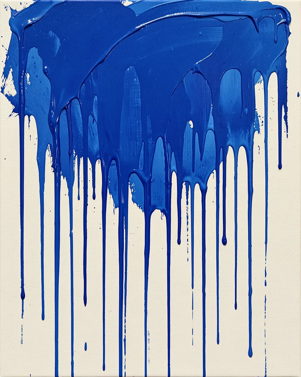 Thick cobalt blue acrylic paint drips vertically across a bare off-white canvas