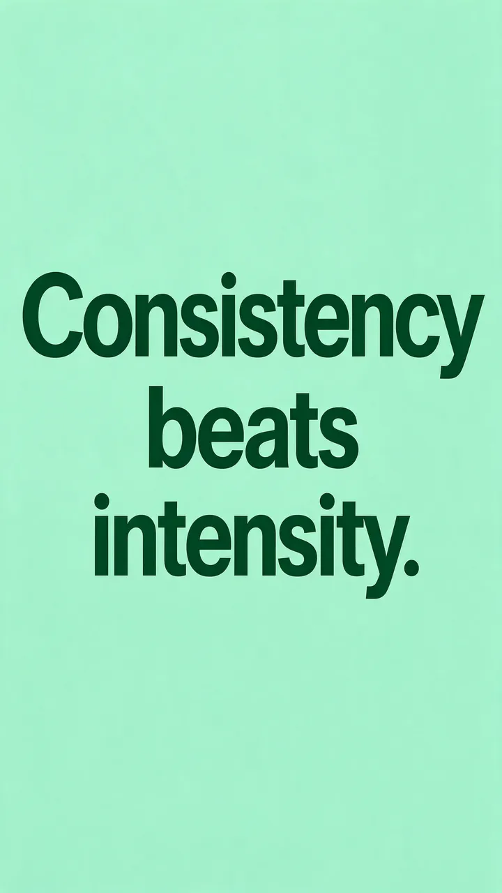 Bold dark green sans-serif text reading "Consistency beats intensity." centered on a fresh mint green vertical background