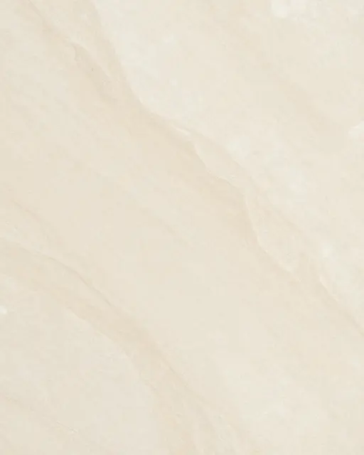 Full frame close-up of a smooth honed beige marble surface with soft tan veining and even lighting