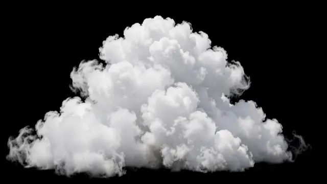A fluffy stacked white cumulus cloud floats against a solid pure black background