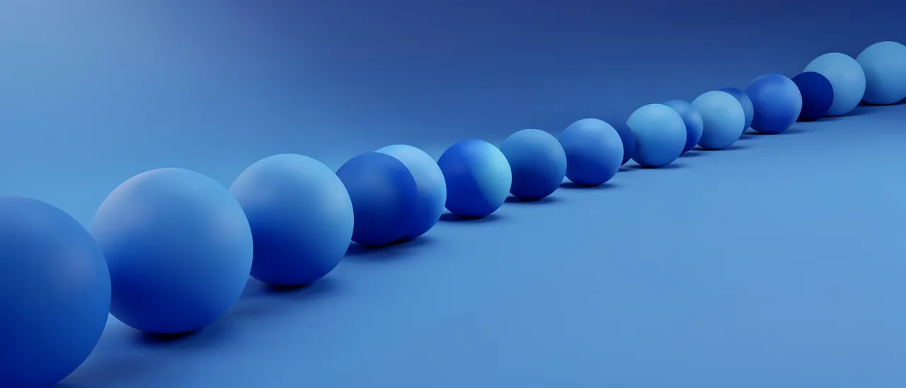 Row of gradient blue matte 3D spheres arranged along a gentle curved path against a matching blue background
