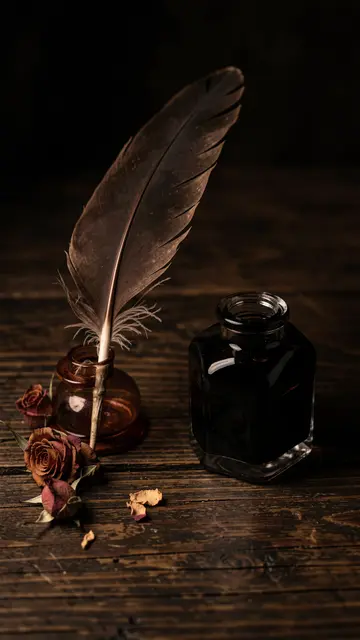 Quill pen, glass inkwells and dried roses arranged on a dark oak table with dramatic chiaroscuro lighting