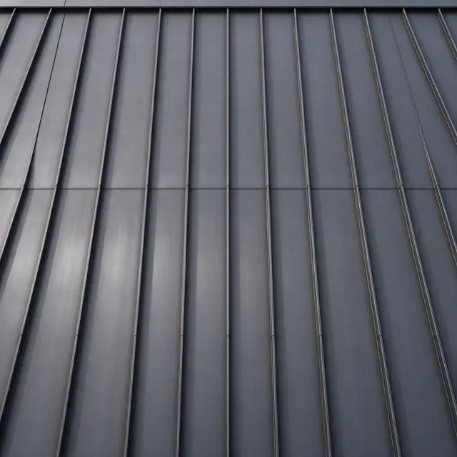 Full frame close-up of matte dark gray standing seam metal paneling with evenly spaced vertical ribs