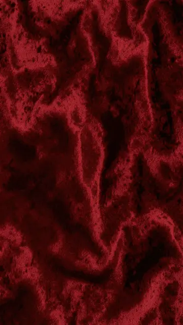 Vertical full frame dark red textured abstract pattern with soft velvet depth variations