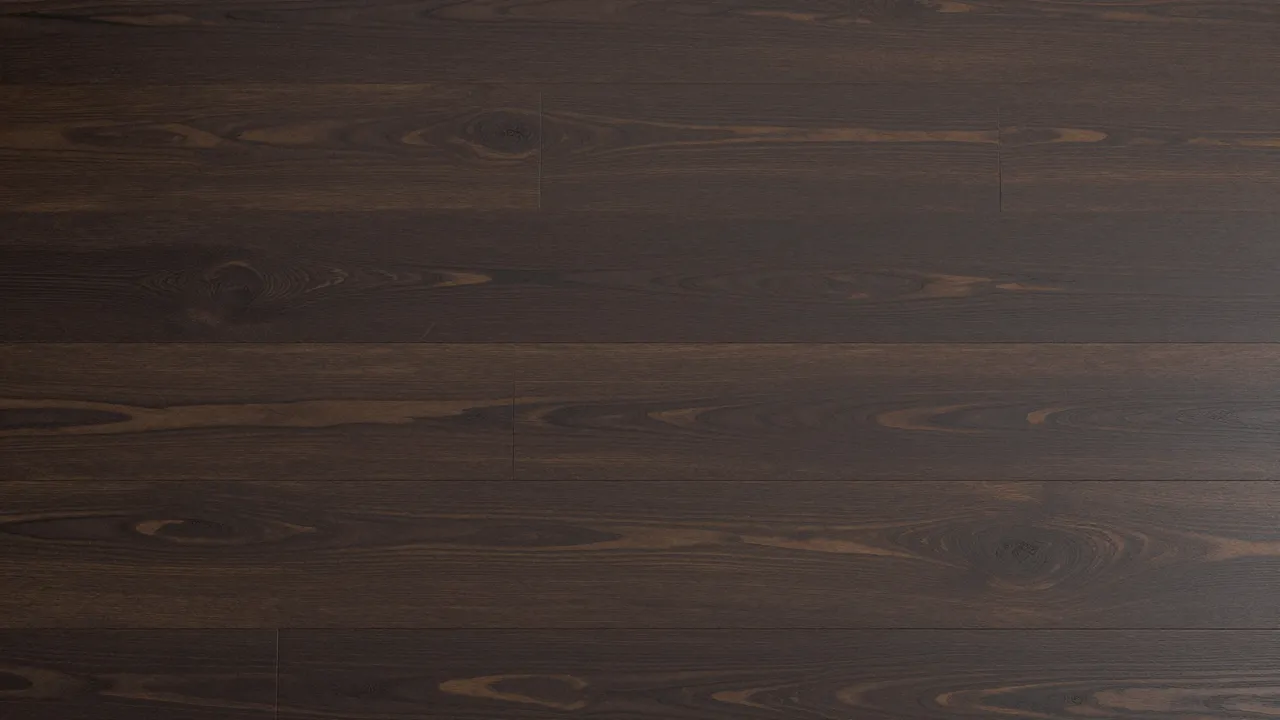 Full frame top view of dark stained wood floorboards with natural grain and subtle satin sheen