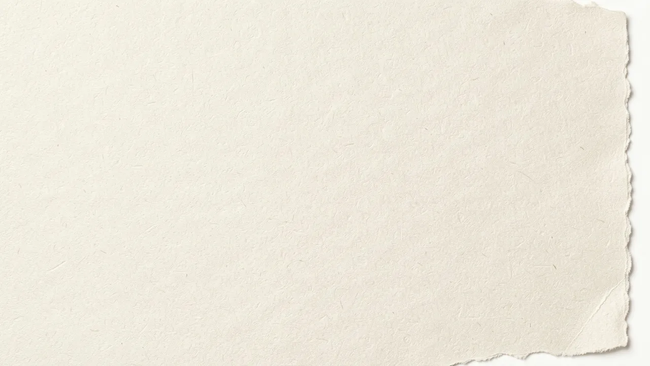 Textured warm off-white handmade paper with a ragged deckled right edge against a plain background