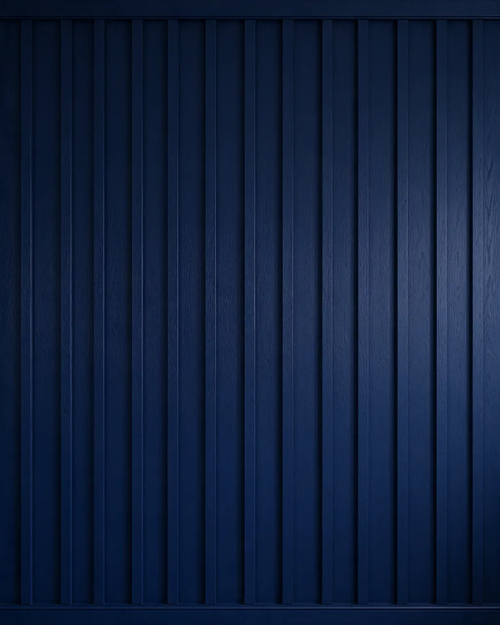 Full frame close-up of evenly spaced deep navy painted board and batten wall texture