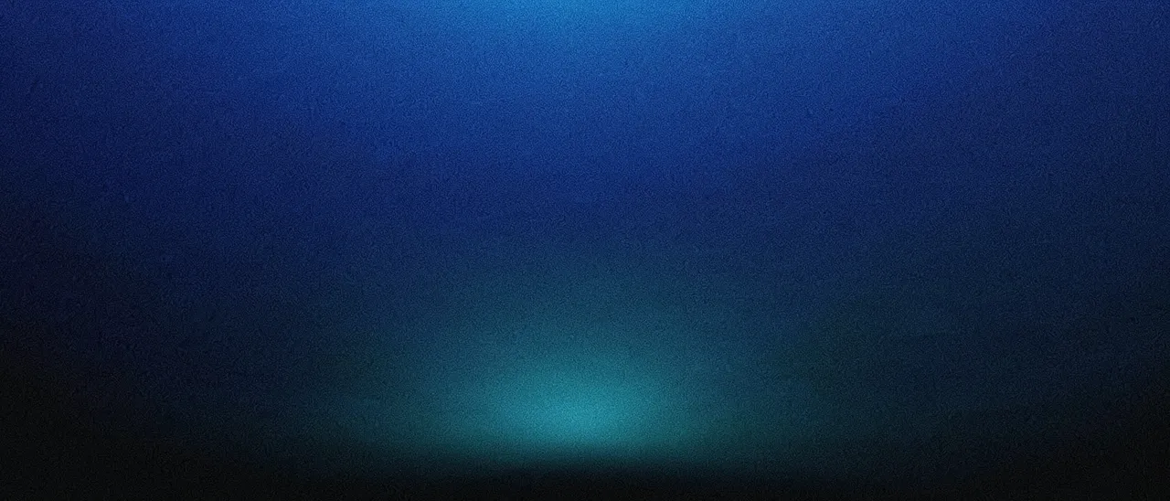 Grainy ultrawide gradient fading from deep blue to black with a faint cyan glow near the lower horizon
