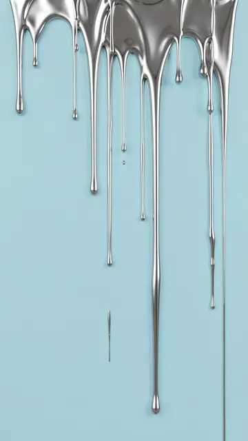 Glossy liquid silver drips run down a smooth soft pastel blue wall