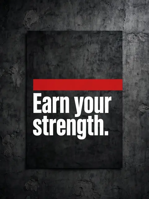 Motivational poster reading "Earn your strength." with a red stripe, mounted on a dark textured concrete wall