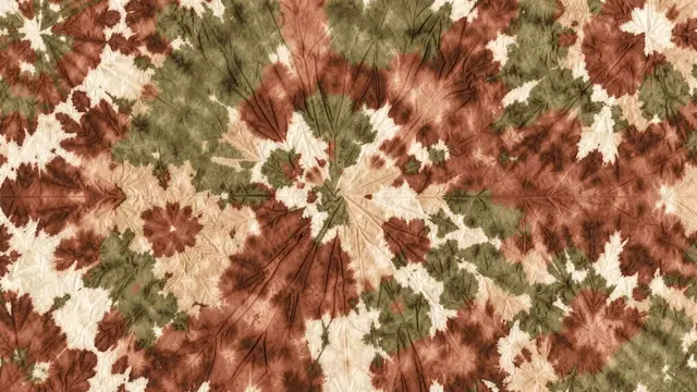 Symmetrical hand-painted tie-dye pattern in rust, olive green and warm sand tones