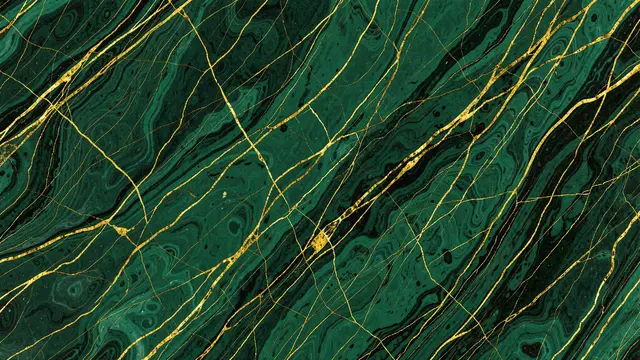 Full frame close-up of marbled paper with deep emerald green, black swirls and fine branching gold vein details