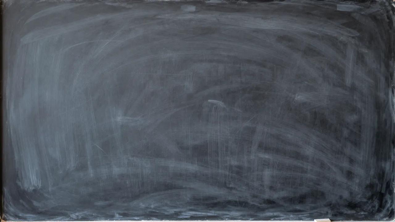 A clean empty dark chalkboard covered in soft, faint chalk smudge marks left from erasing.