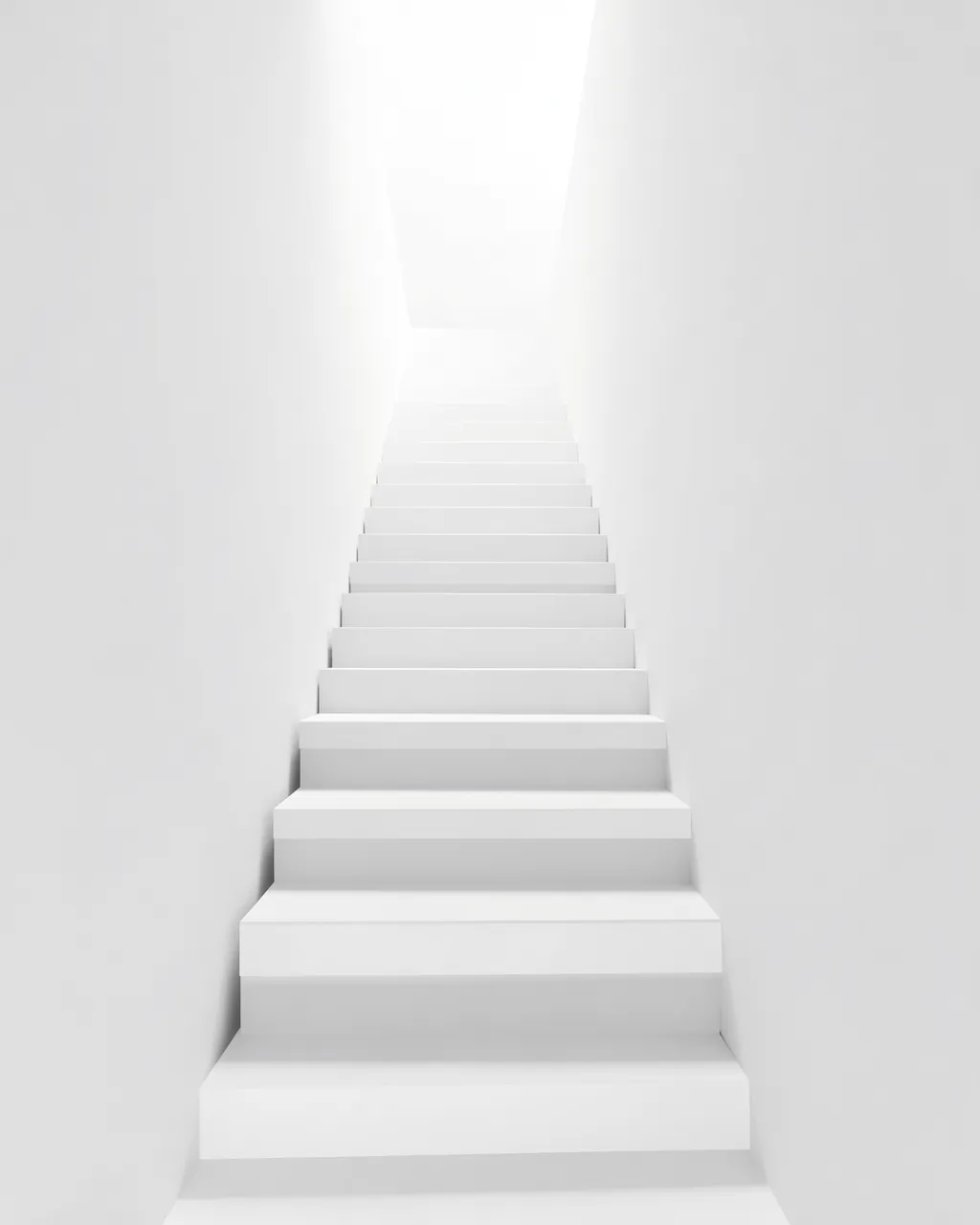 A minimalist white staircase rises into bright overexposed light within an empty all-white space