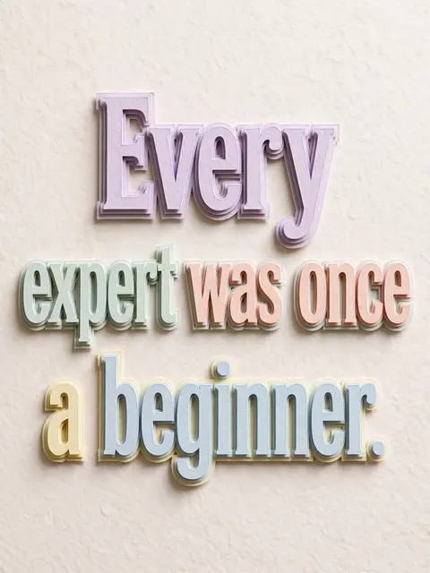 Layered pastel paper cut-out lettering spelling "Every expert was once a beginner." casts soft shadows on a pale textured