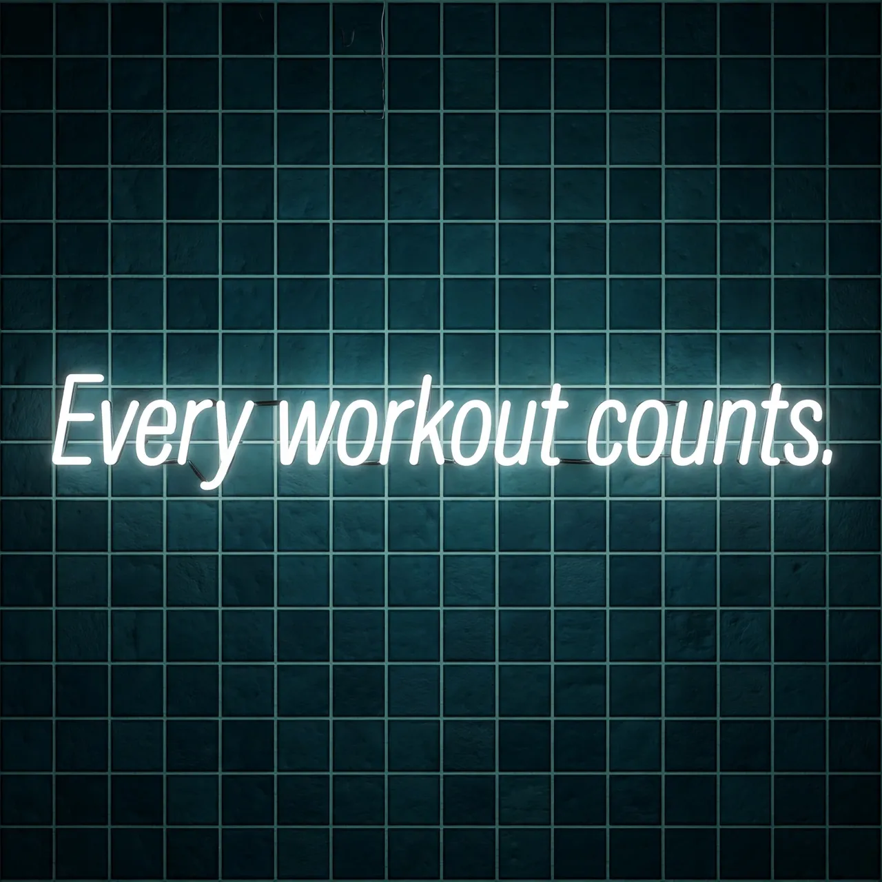 Glowing white neon sign reading "Every workout counts." mounted on a dark teal tiled wall