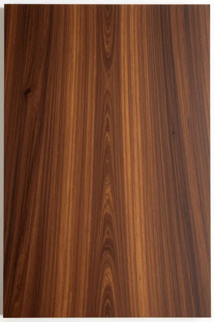 Full frame close-up of exotic hardwood with contrasting dark brown and golden vertical grain bands