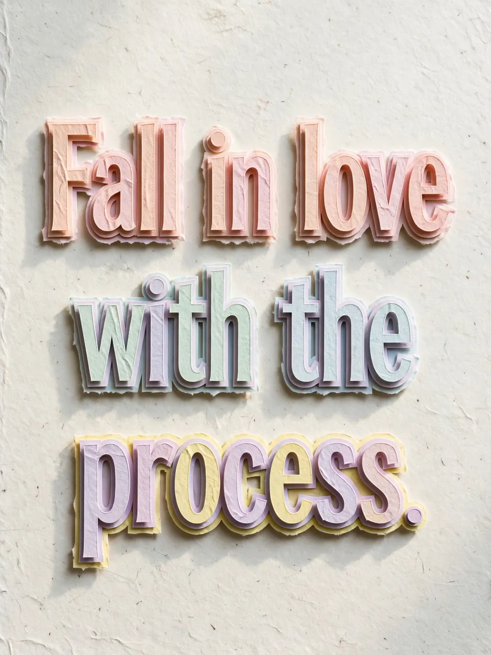 Layered pastel paper cut-out lettering spelling "Fall in love with the process." casts soft shadows on a pale textured