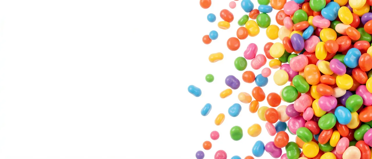 Bright multicolored jelly beans spill in from the right against an empty white left banner space
