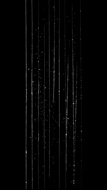Vertical thin film scratches and glowing flickering specks over a solid pure black background