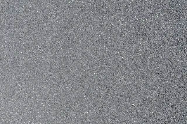 Top-down view of uniform fine gray gravel texture filling the entire frame