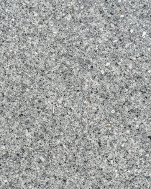 Full frame close-up of rough flamed gray granite with embedded mineral aggregate grains under flat even light
