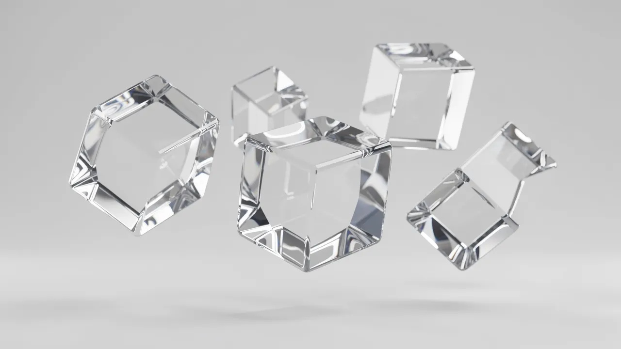 Several translucent glass cubes float mid-air against a soft light gray background