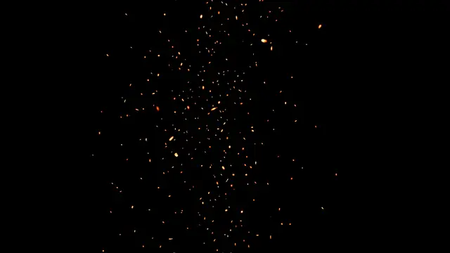Tiny glowing golden and orange embers drift upward against a solid pure black background