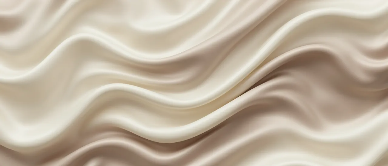 Smooth folded cream and warm taupe silk forms soft undulating waves across the frame