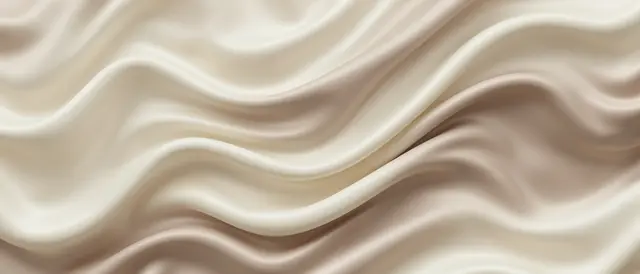 Smooth folded cream and warm taupe silk forms soft undulating waves across the frame