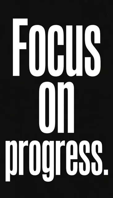 Bold white condensed text reading "Focus on progress." centered on a solid black vertical phone wallpaper background