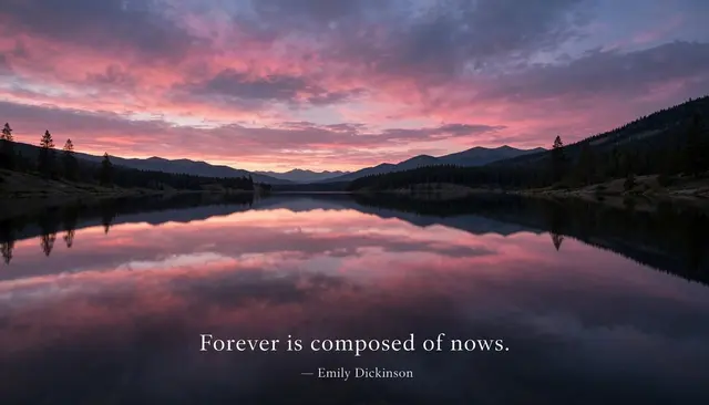Calm mountain lake reflects a pink dusk sky, overlaid with the quote "Forever is composed of nows. — Emily Dickinson"