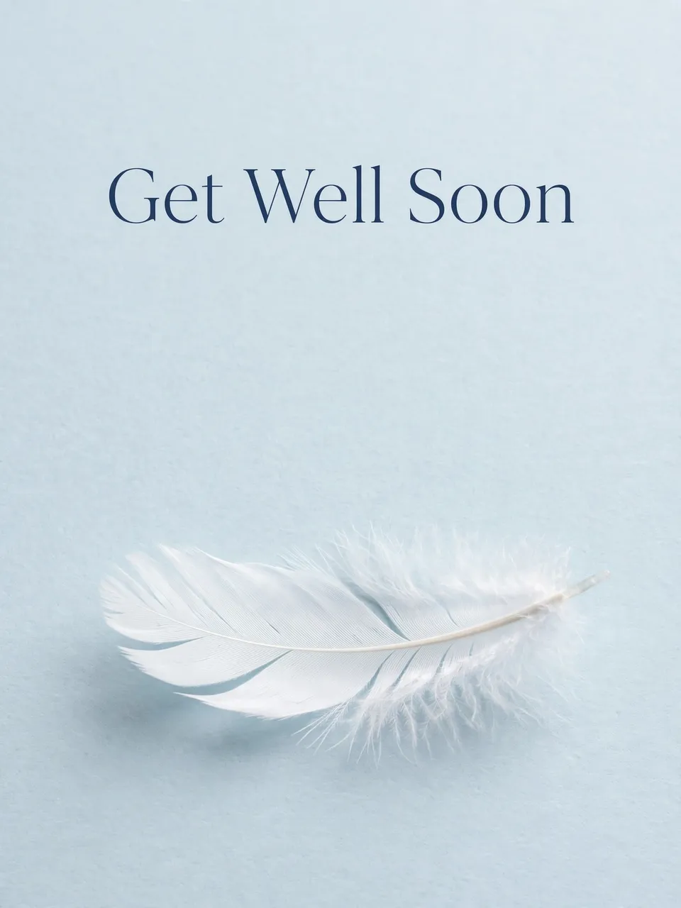 "Get Well Soon" in navy serif text sits above a single white feather on a pale blue background
