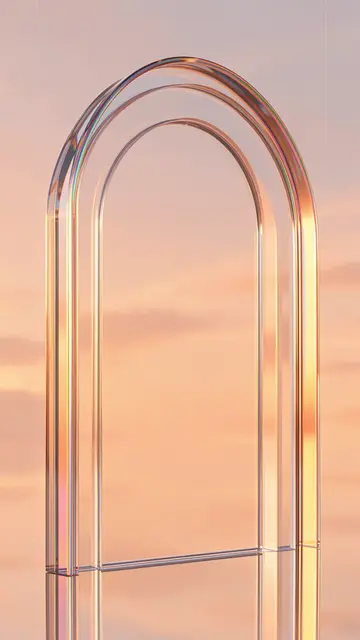 Translucent layered glass arch refracting soft peach and pink sunset sky with iridescent edge highlights