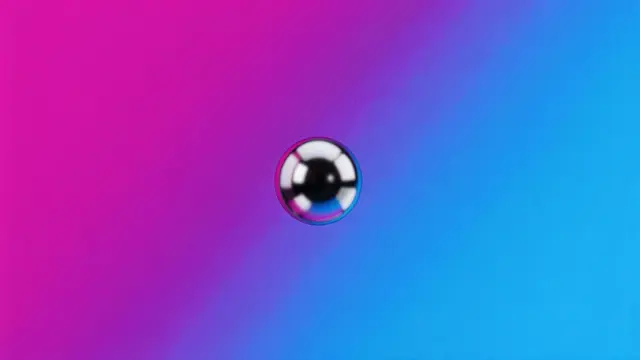 A glossy chrome sphere floats centered over a magenta to electric blue grainy gradient background