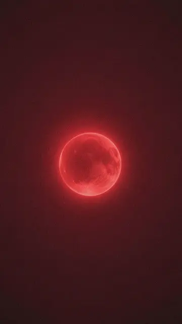 A glowing textured red orb sits centered against a grainy deep maroon vertical gradient background