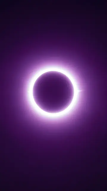 A bright white annular solar eclipse glows against a smooth dark violet gradient sky