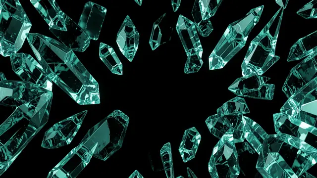 Faceted teal crystal shards arranged in a ring around empty black copy space