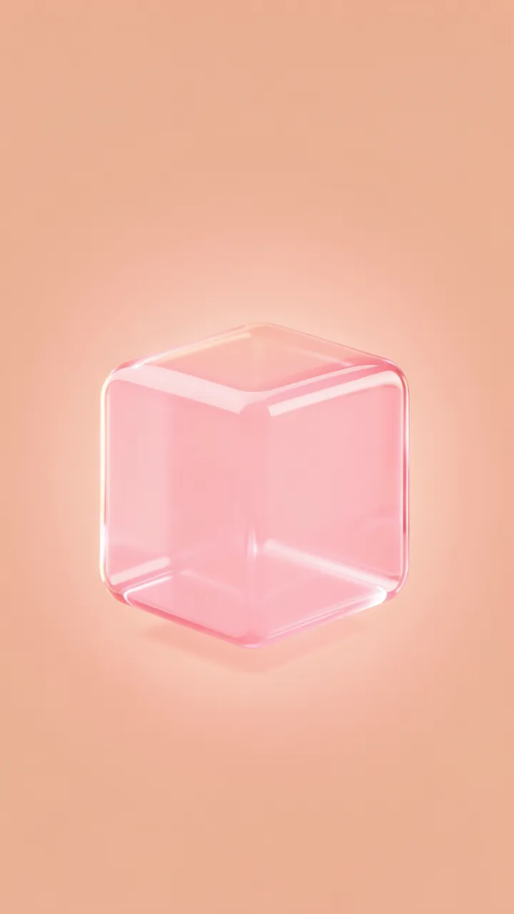 A soft translucent rounded pink glass cube glows against a smooth peach background