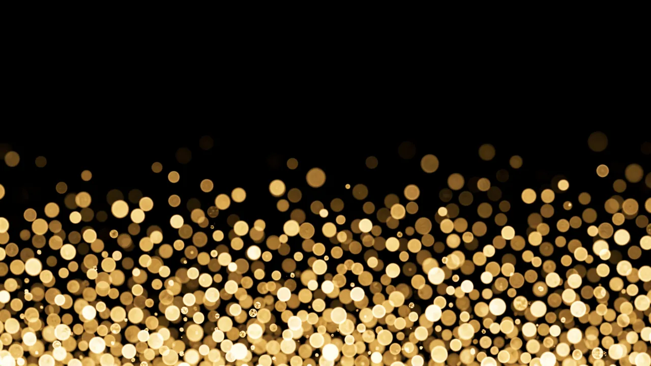 Warm golden champagne-style bokeh dots gather in the lower frame and fade upward on a pure black background