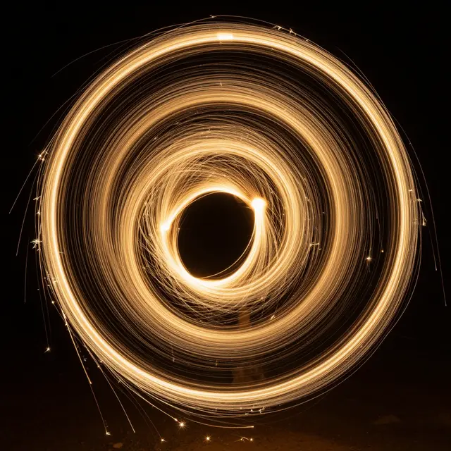 Glowing concentric golden spiral light trails are set against a solid black background