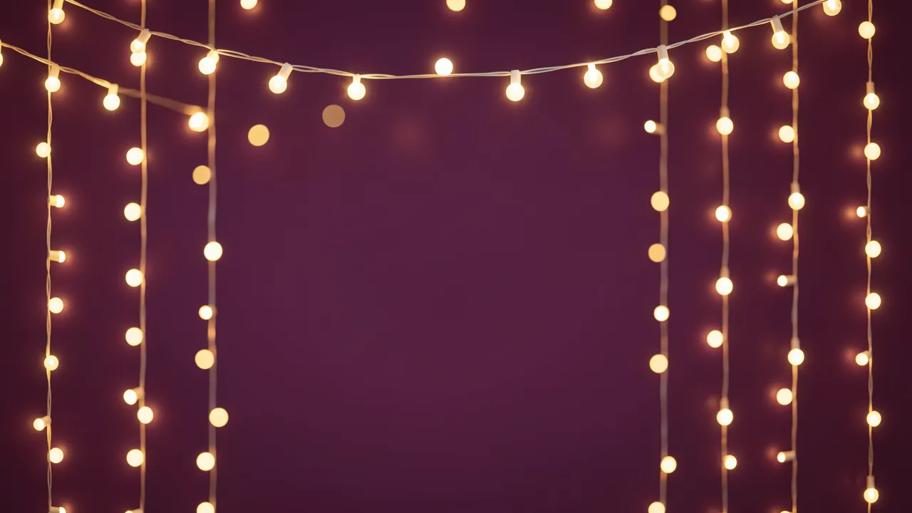 Warm golden fairy light bokeh frames an empty deep plum colored center space