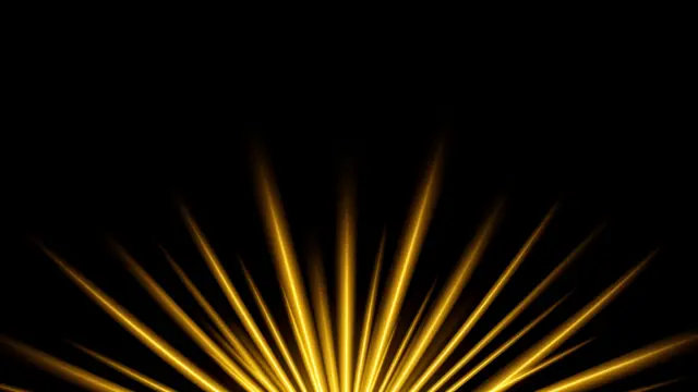 Glowing golden light rays fan upward from the bottom edge against a solid pure black background