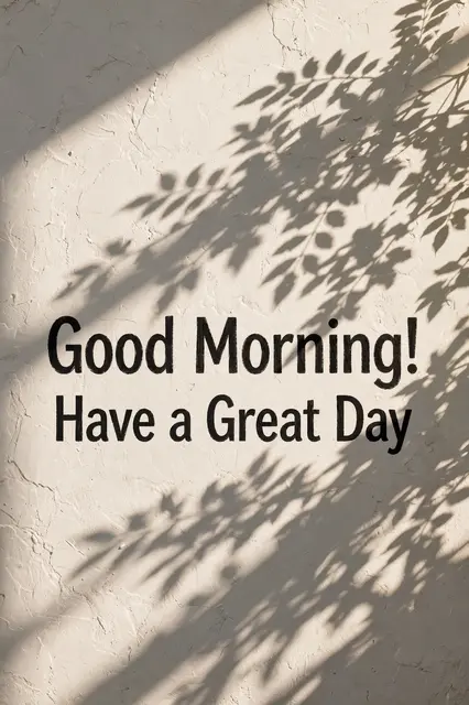 "Good Morning! Have a Great Day" text over leaf shadows on a sunlit textured white wall