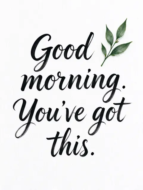 Black brush lettering reading "Good morning. You've got this." sits on white watercolor paper with a small green leaf sprig